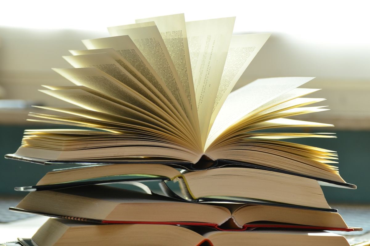 Bound newspaper volumes on archive shelves